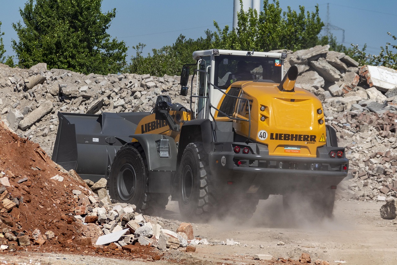 Wheel loader moving rubble at an industrial work site